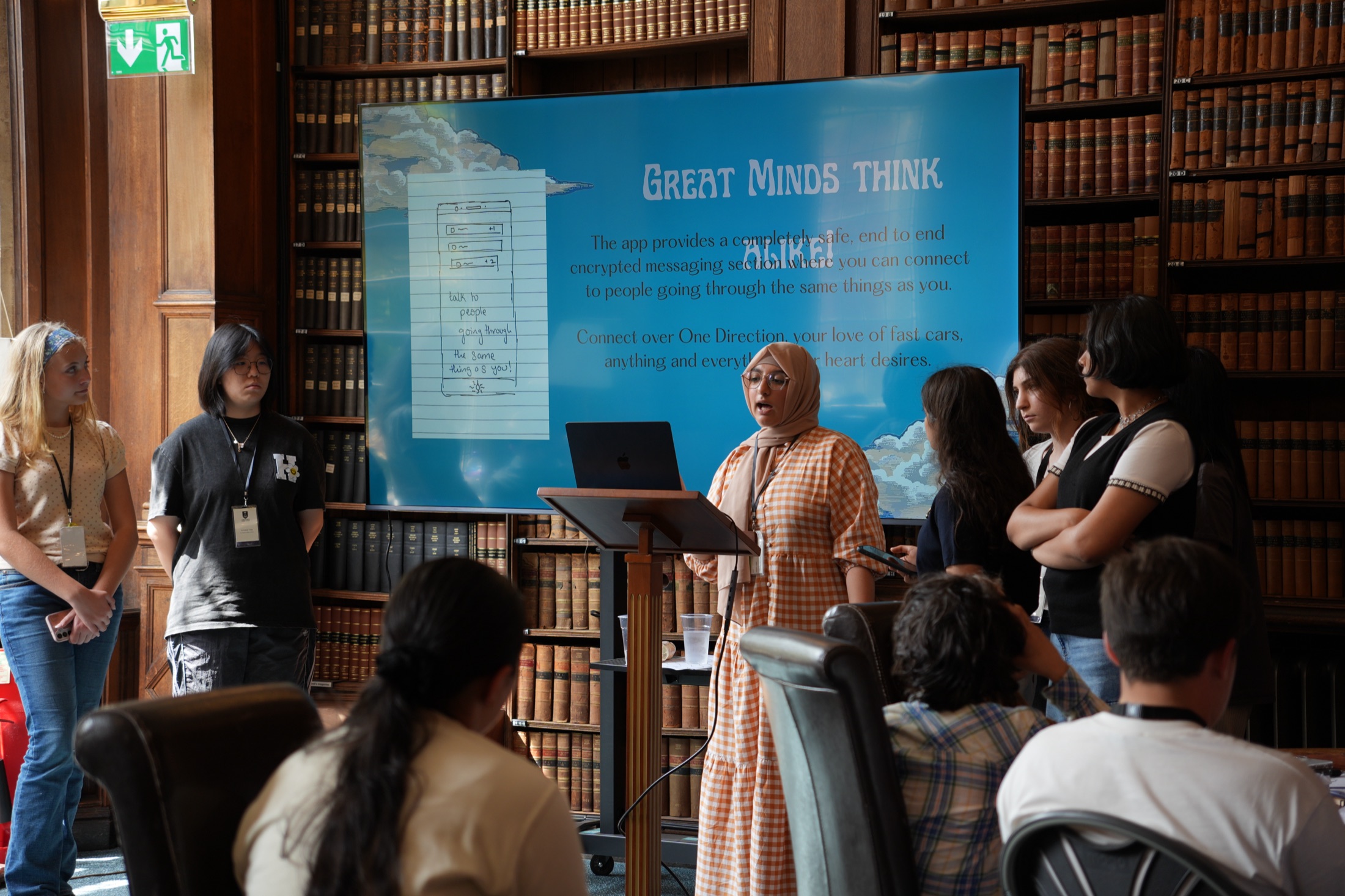 Students presenting their work to an international cohort