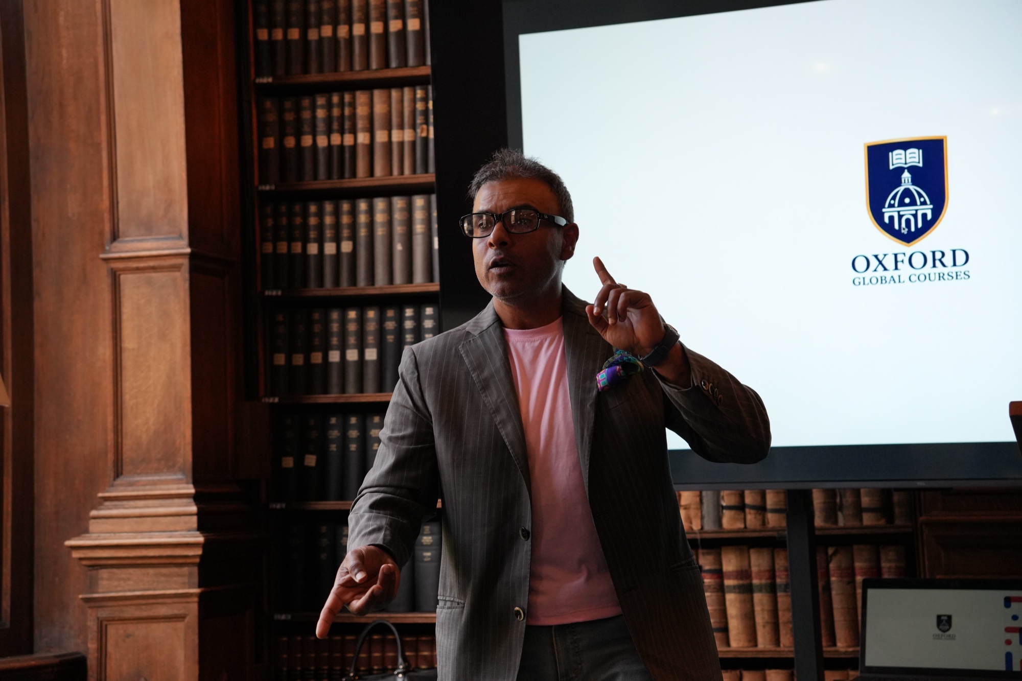 An executive programme speaker presenting in an Oxford library