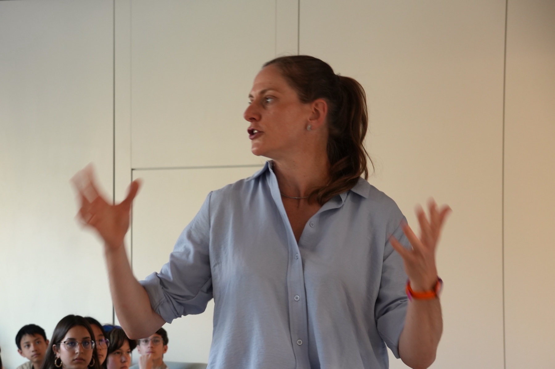A guest speaker leading a discussion with students