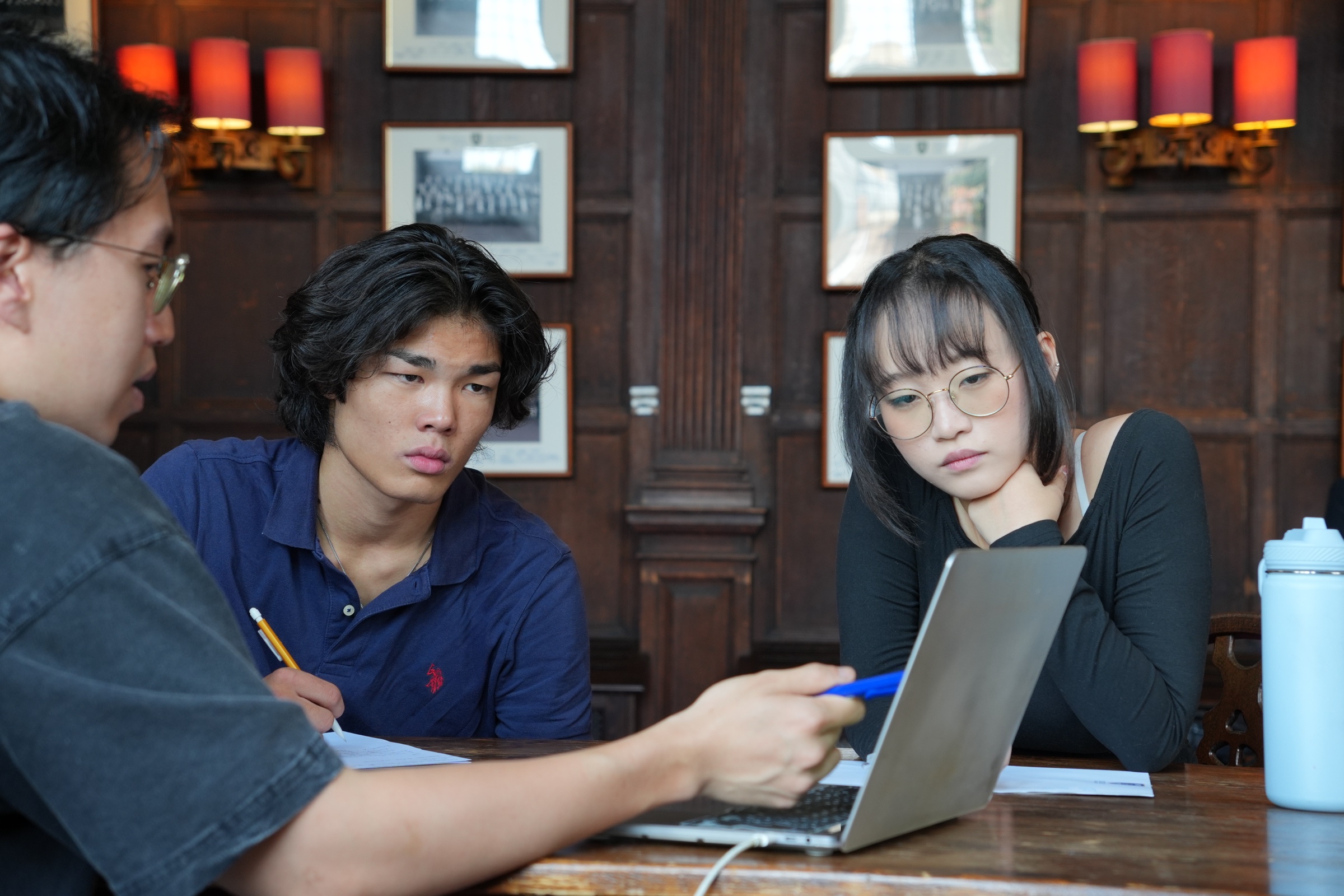 Students taking part in a close Oxford-style tutorial